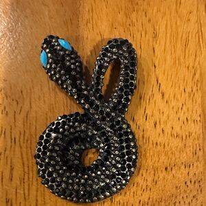 Black Beaded Snake Pendant with turquoise eyes.